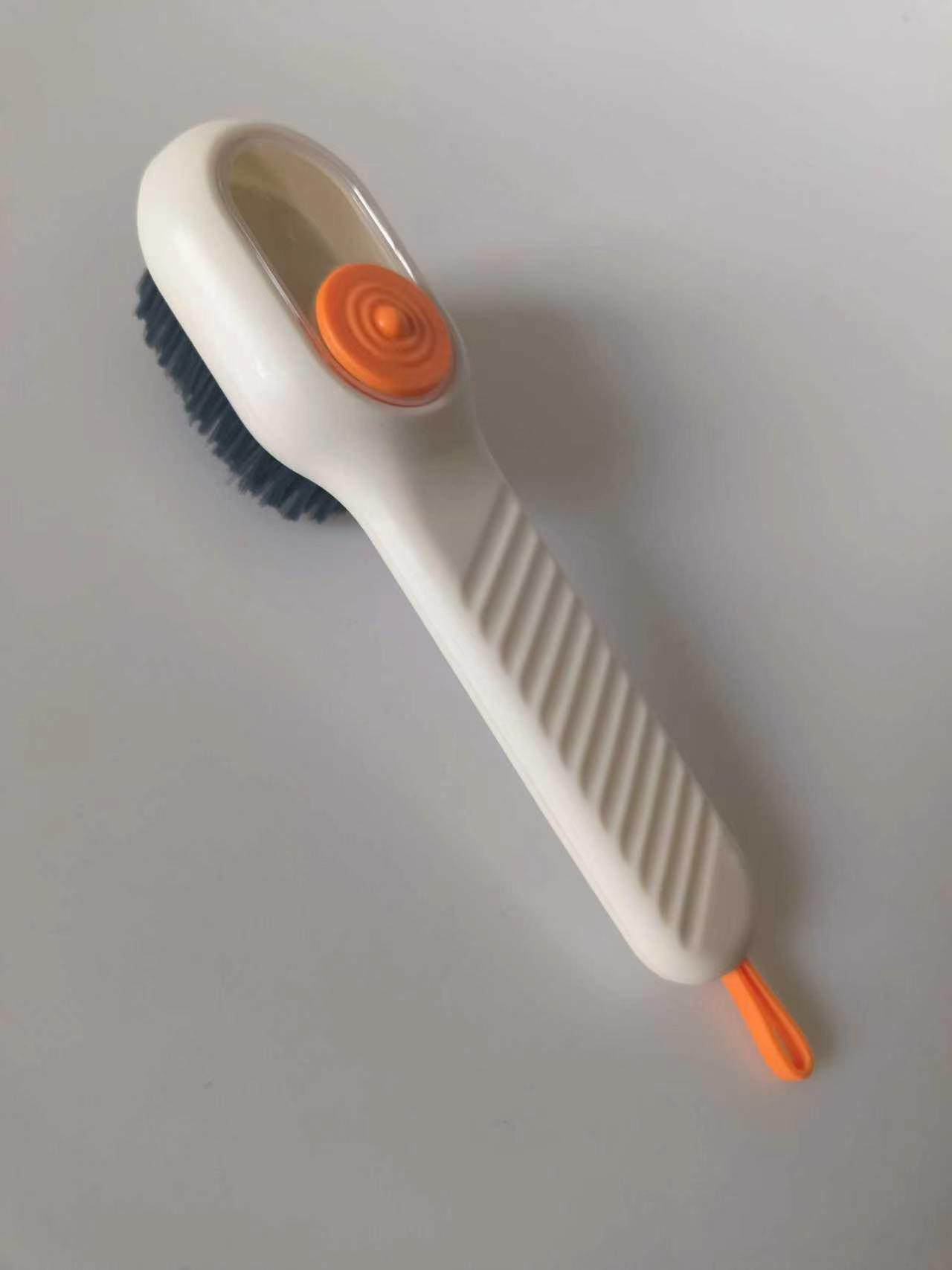 Multifunctional soap-dispensing shoe brush